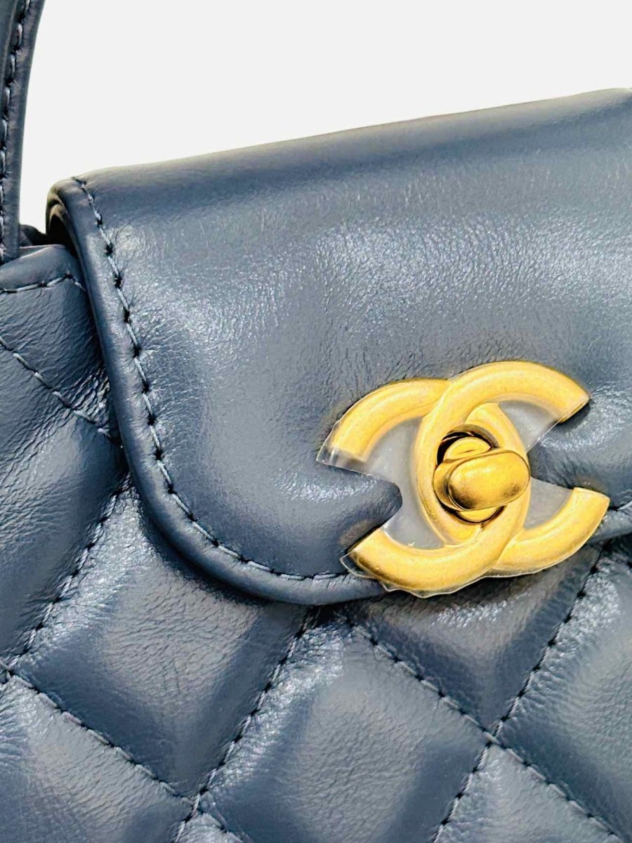 Pre-loved CHANEL 2023 Kelly Blue Quilted Clutch from Reems Closet