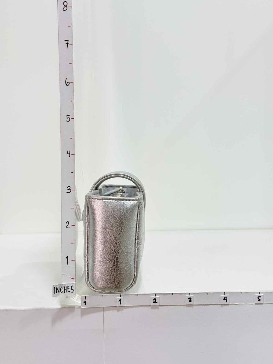 Pre-loved CHANEL Metallic Silver Quilted Phone case at Reems Closet