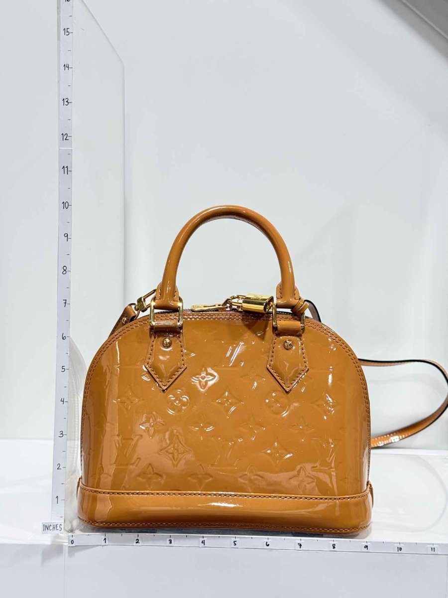 Pre-loved LOUIS VUITTON Alma Tan Monogram Top Handle at Reems Closet