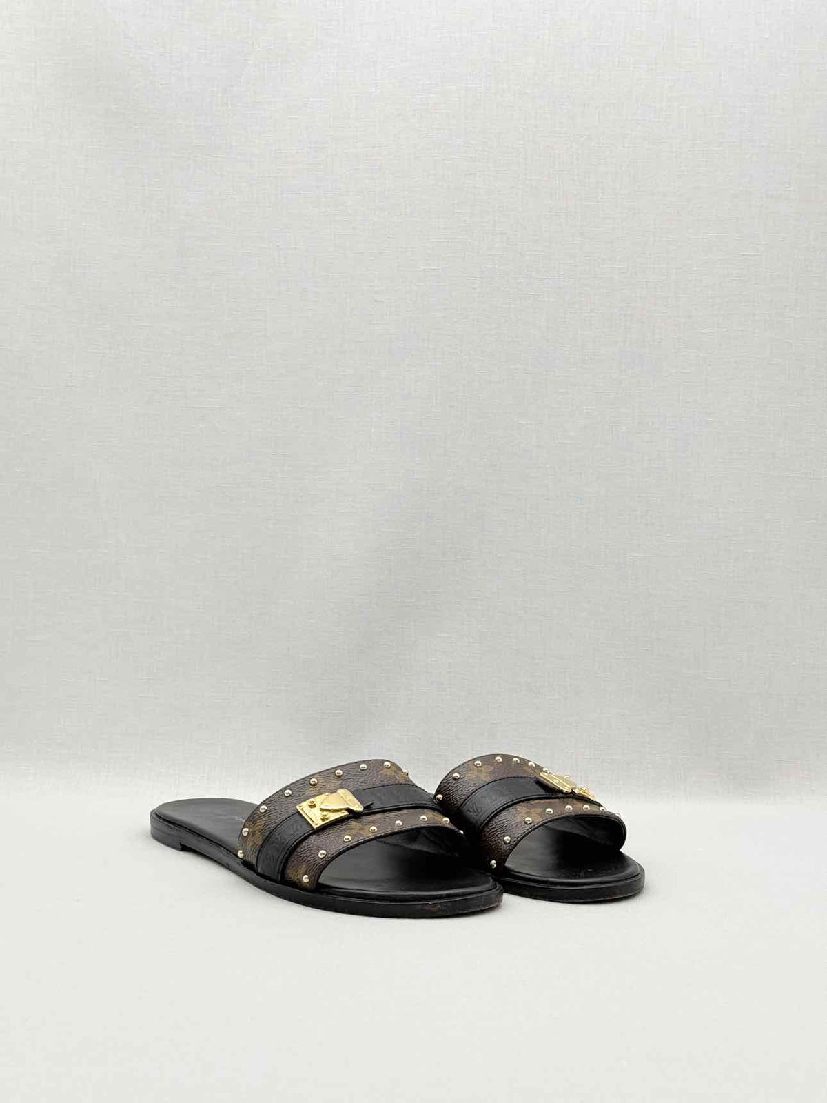 LOUIS VUITTON LOCK IT Brown & Black Size EU 37.5 Slides