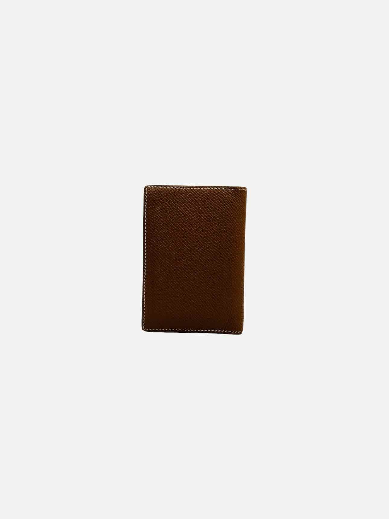 Pre - loved HERMES MC2 Euclide Gold Card Holder at Reems Closet