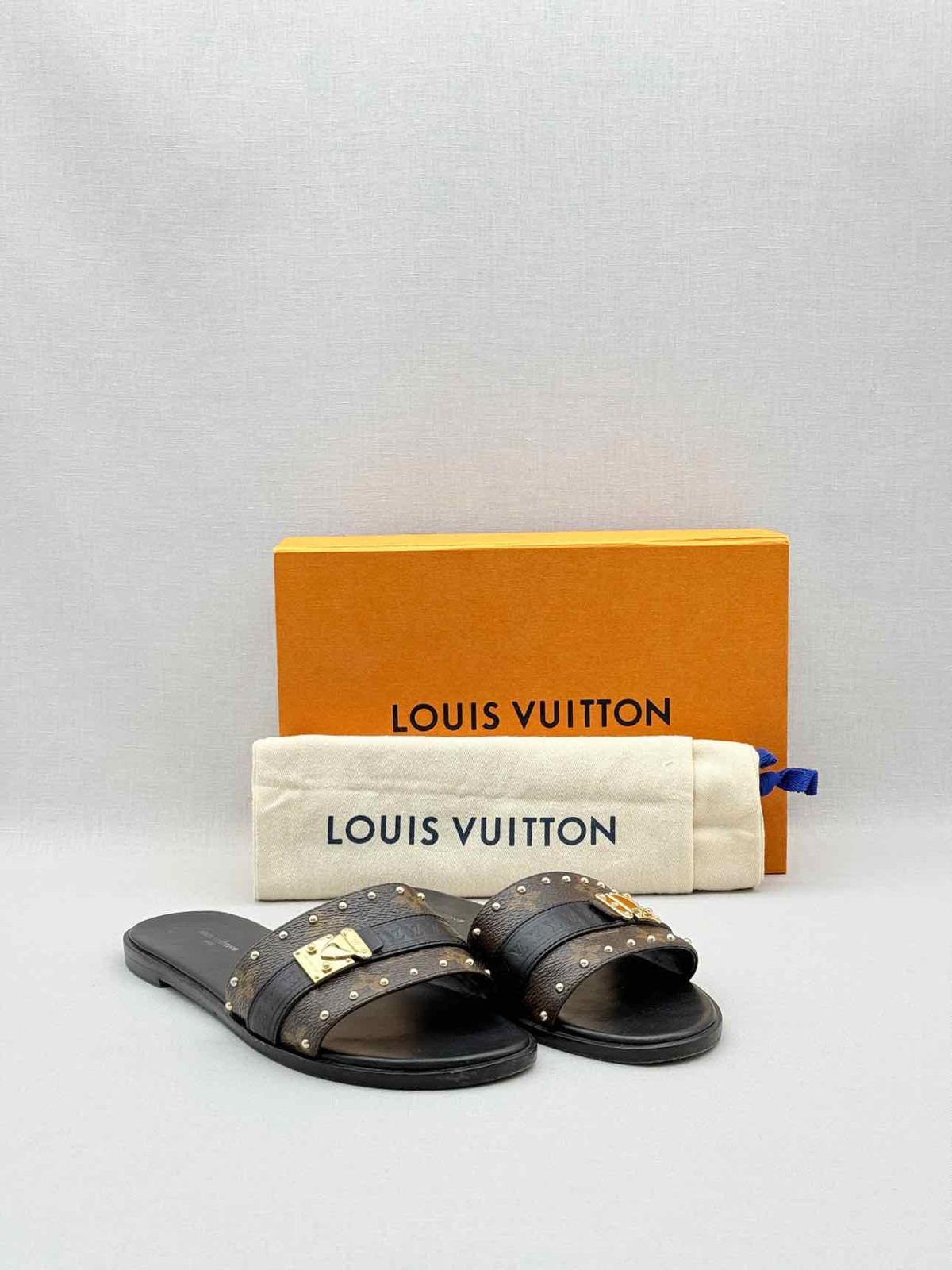 LOUIS VUITTON LOCK IT Brown & Black Size EU 37.5 Slides