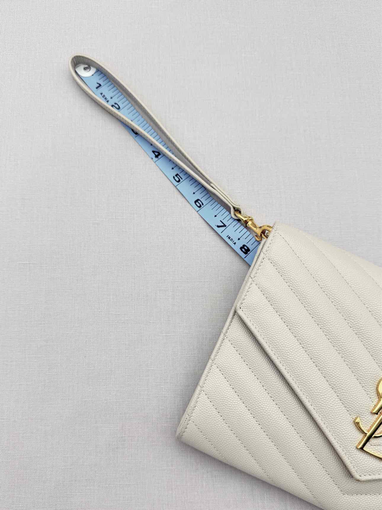 SAINT LAURENT Cassandre Matelasse Flap White Wristlet