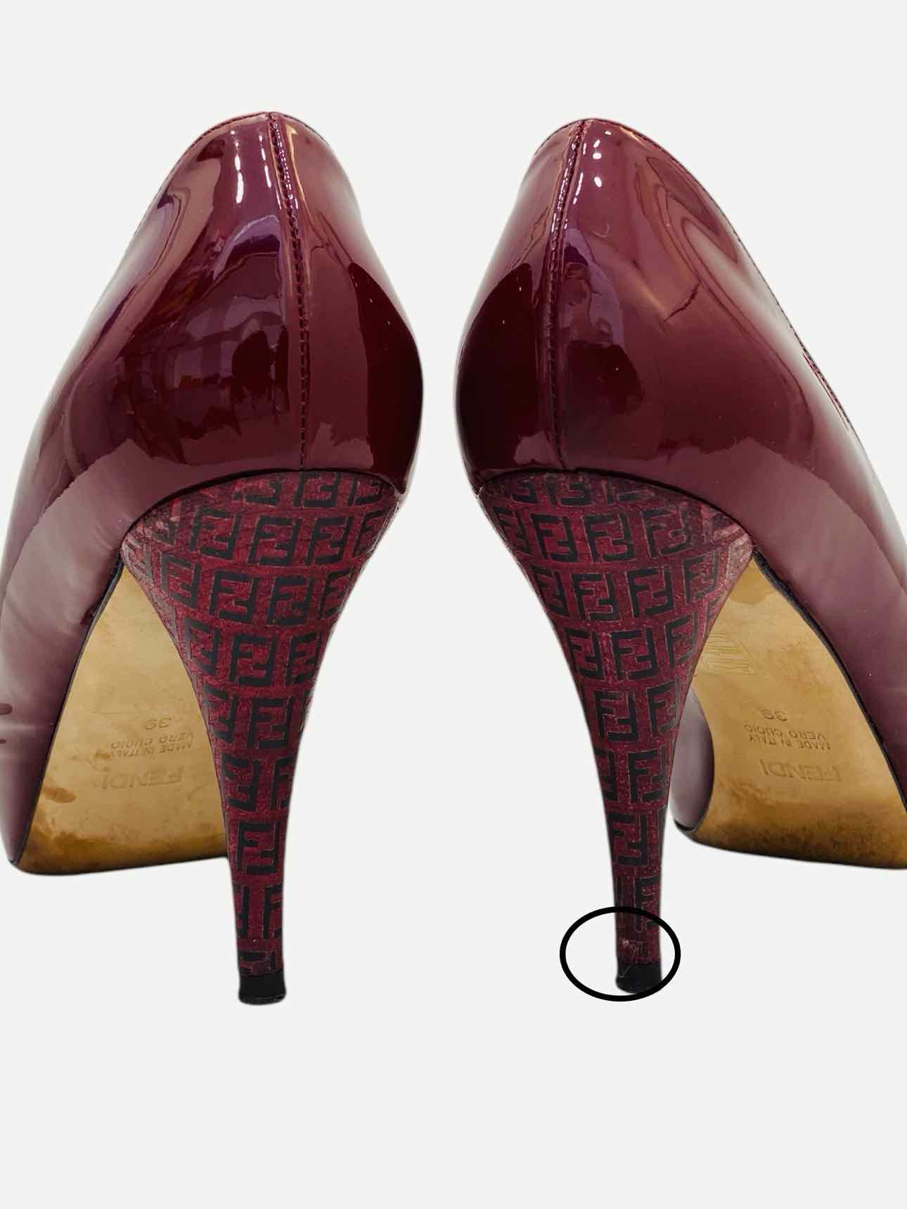 Pre-loved FENDI Ruby Red FF Motif Pumps from Reems Closet