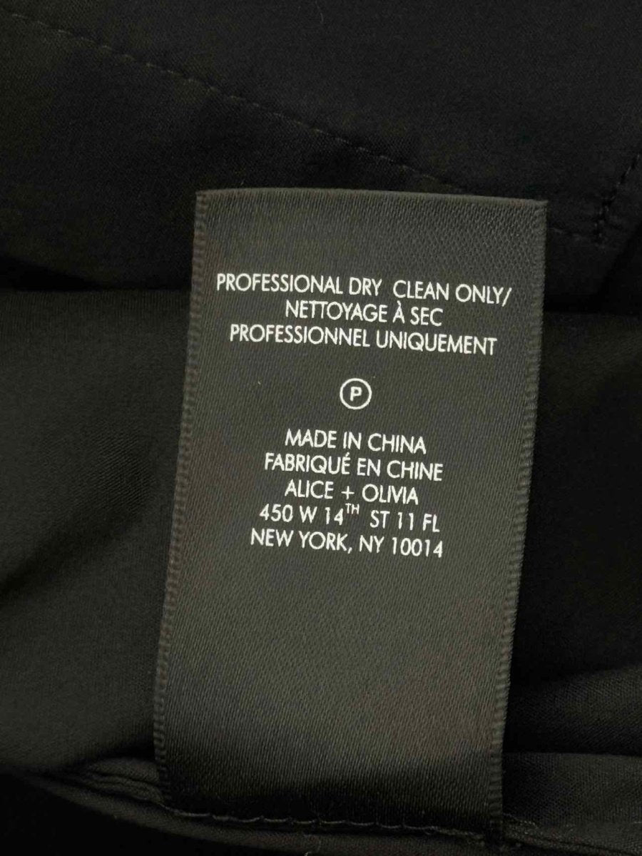 Pre - loved ALICE + OLIVIA Black w/ White Trim Size XSmall Blouse at Reems Closet