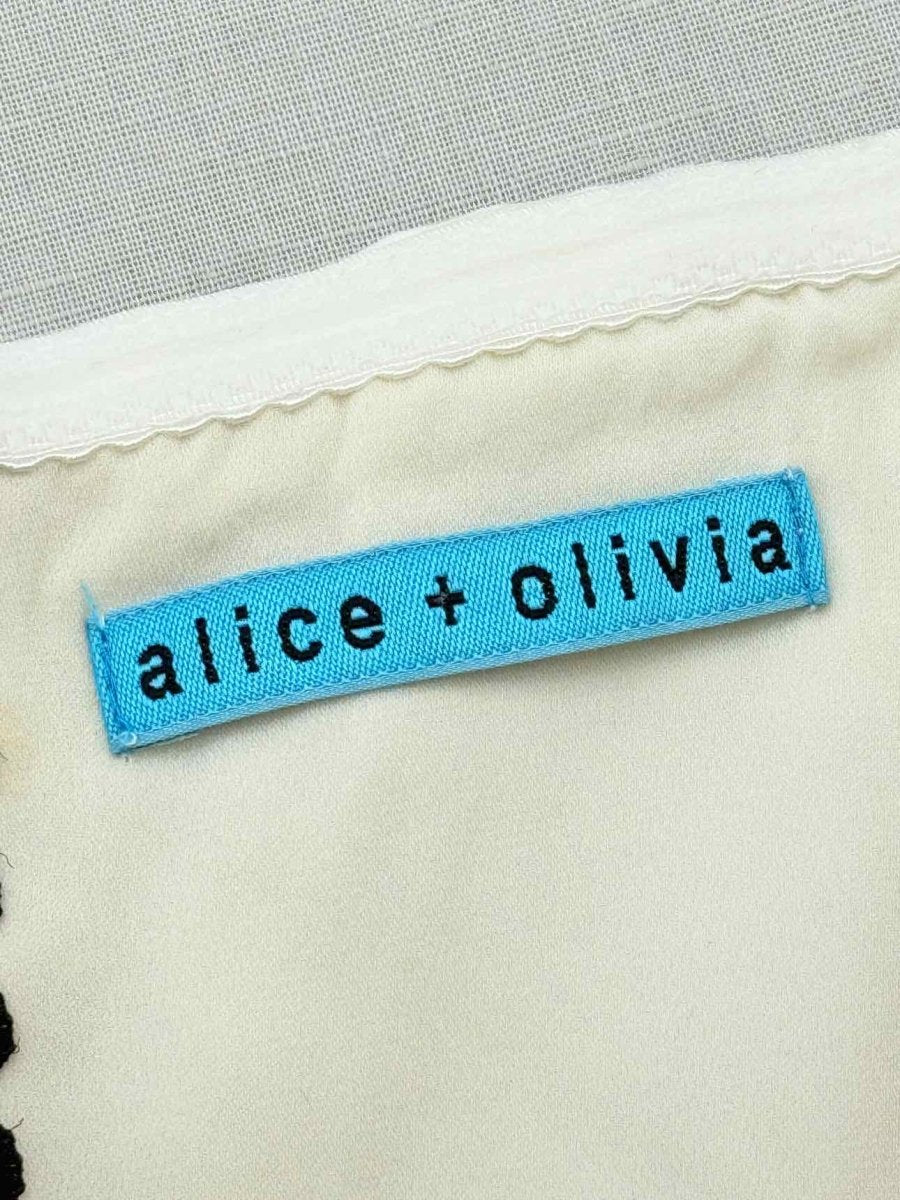 Pre - loved ALICE + OLIVIA White Polka Dot Size Small Top at Reems Closet