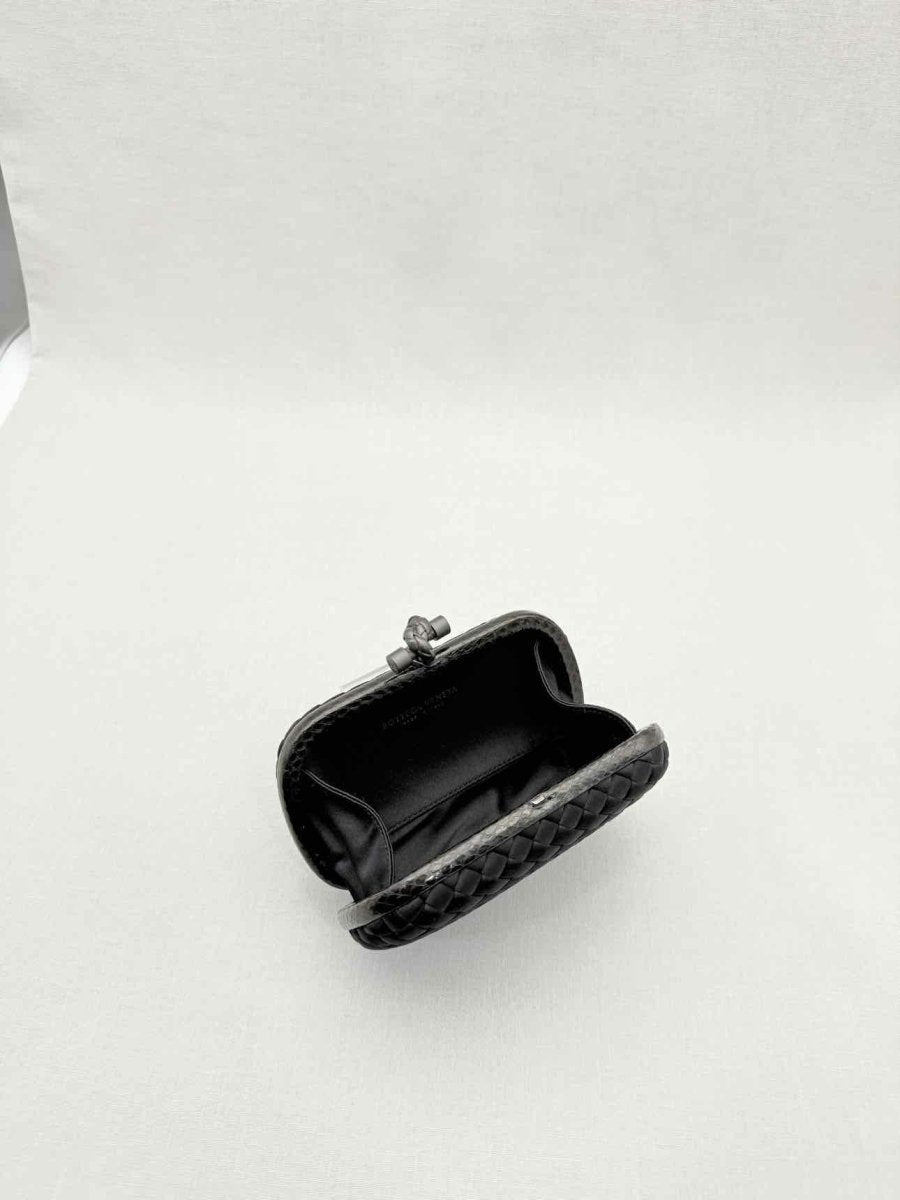 Pre - loved BOTTEGA VENETA Knot Black Intrecciato Clutch at Reems Closet