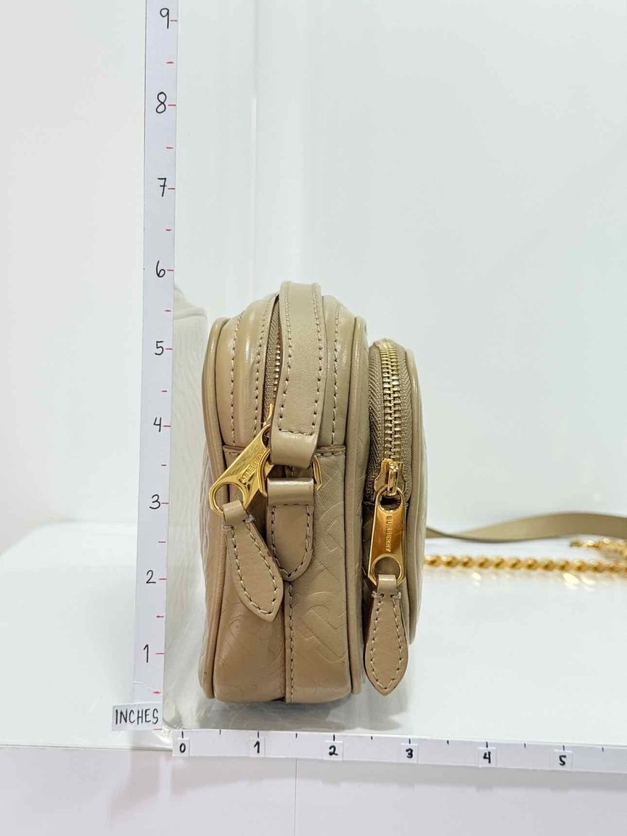 Pre - loved BURBERRY Beige Monogram Embossed Crossbody at Reems Closet