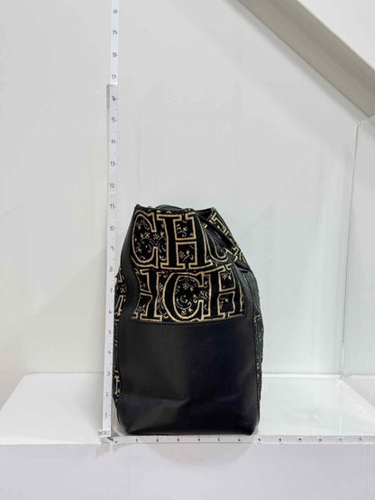 Pre-loved CAROLINA HERRERA Black & Gold Monogram Tote Bag at Reems Closet