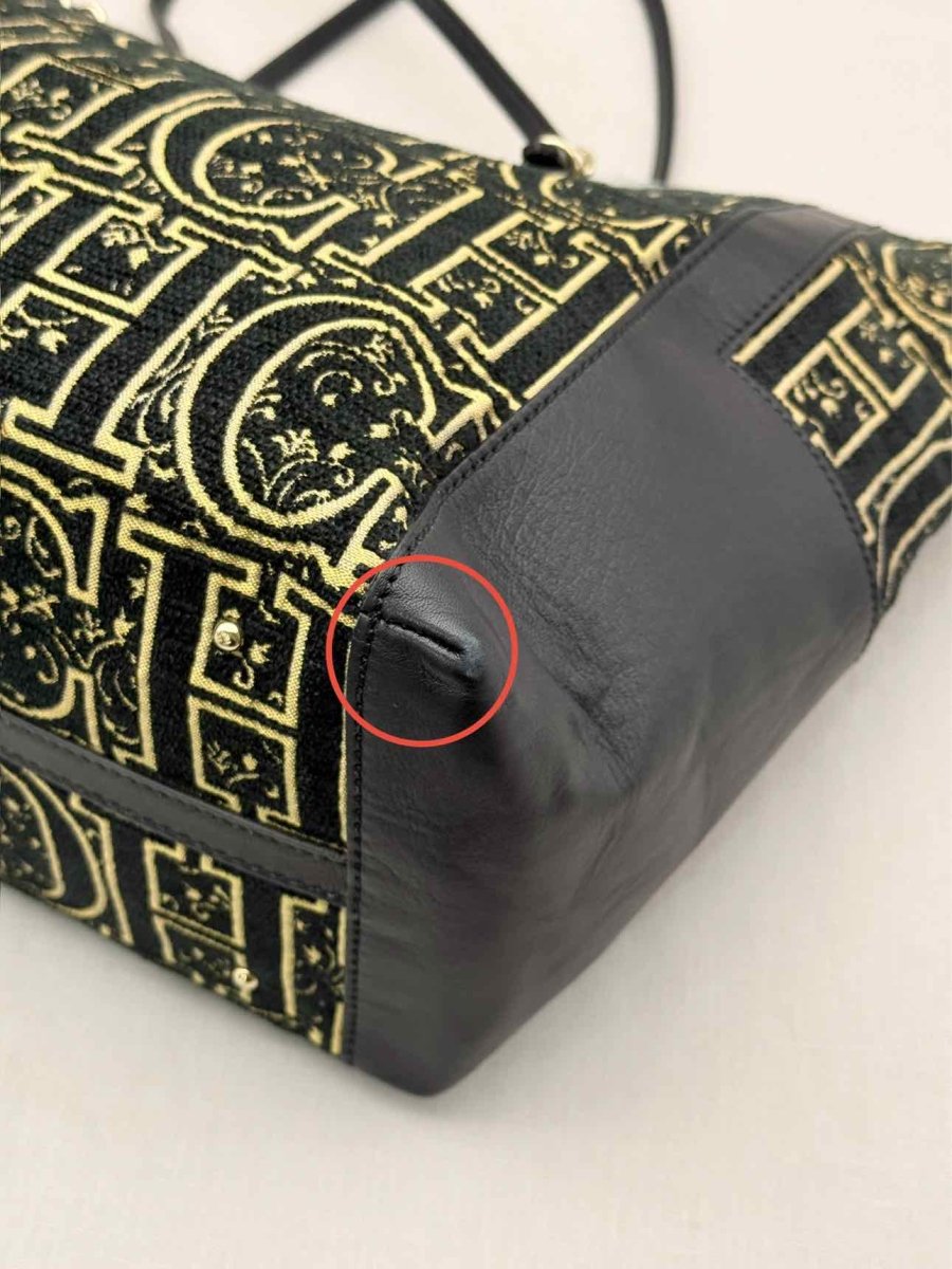 Pre-loved CAROLINA HERRERA Black & Gold Monogram Tote Bag at Reems Closet