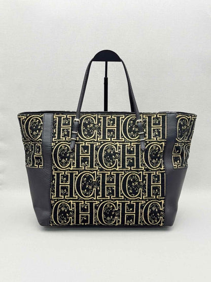 Pre-loved CAROLINA HERRERA Black & Gold Monogram Tote Bag at Reems Closet