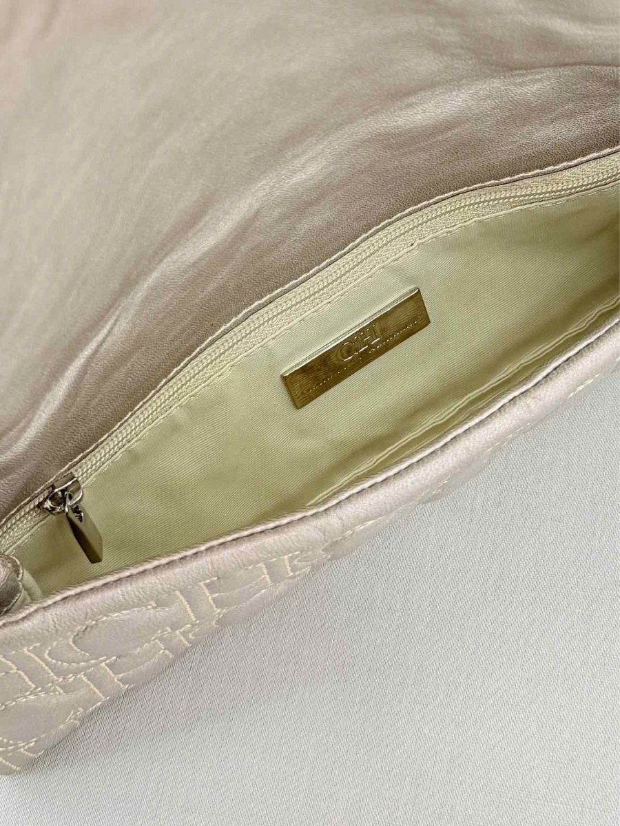 Pre - loved CAROLINA HERRERA Grey Monogram Clutch at Reems Closet