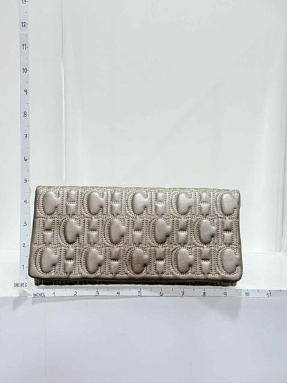 Pre - loved CAROLINA HERRERA Grey Monogram Clutch at Reems Closet