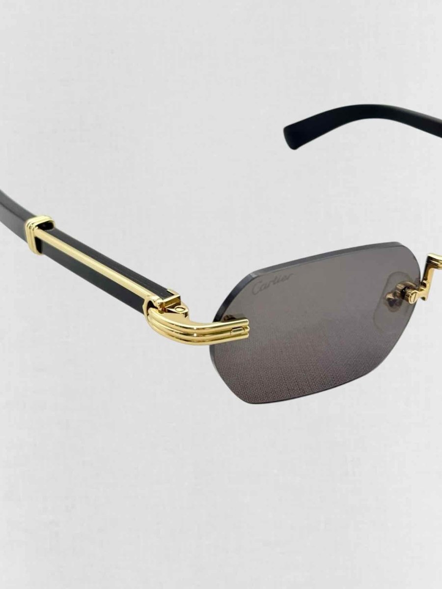 Pre - loved CARTIER Premiere de Cartier Black & Gold Sunglasses at Reems Closet