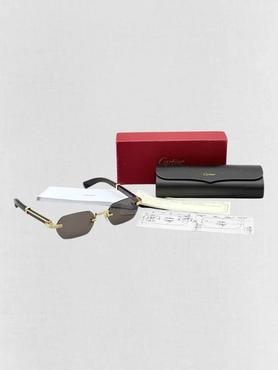 Pre - loved CARTIER Premiere de Cartier Black & Gold Sunglasses at Reems Closet