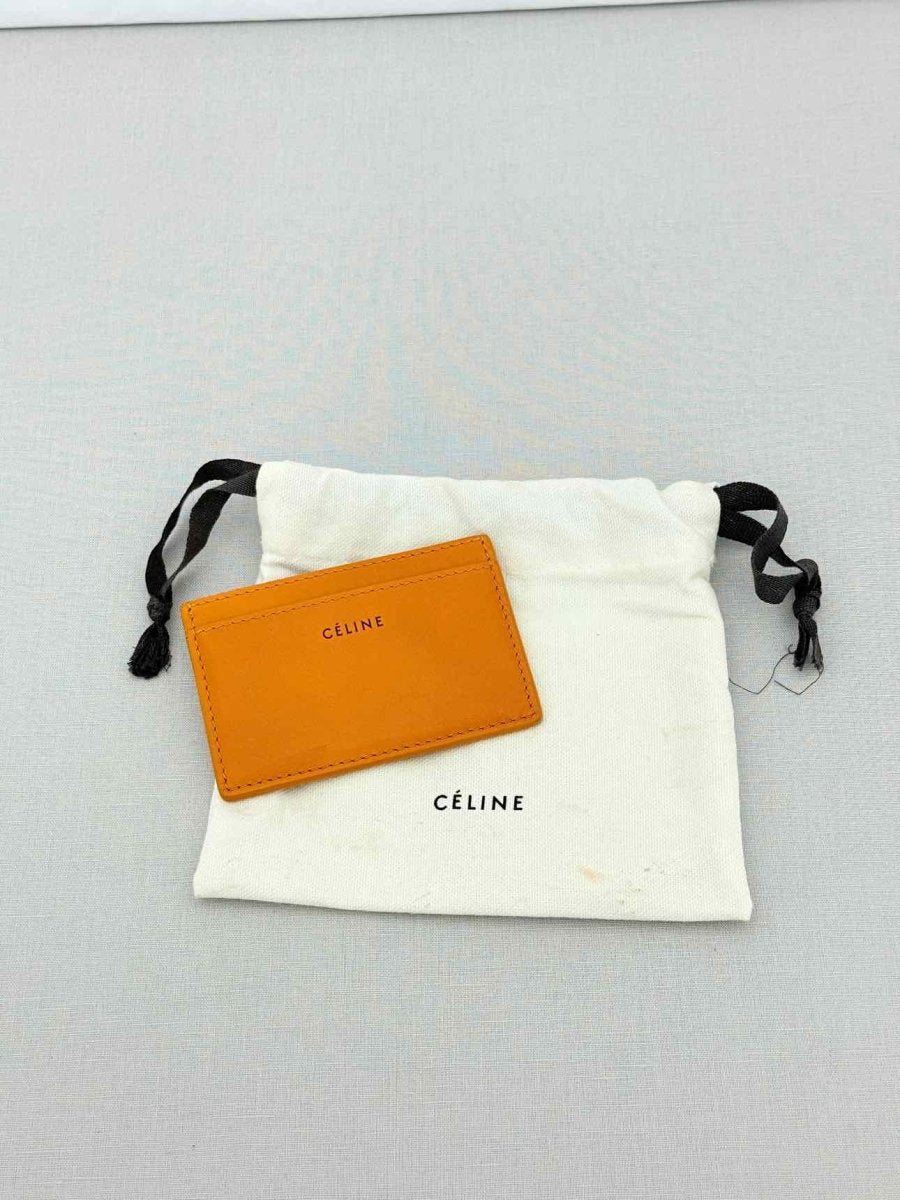 Pre - loved CELINE Yellow Card Holder at Reems Closet