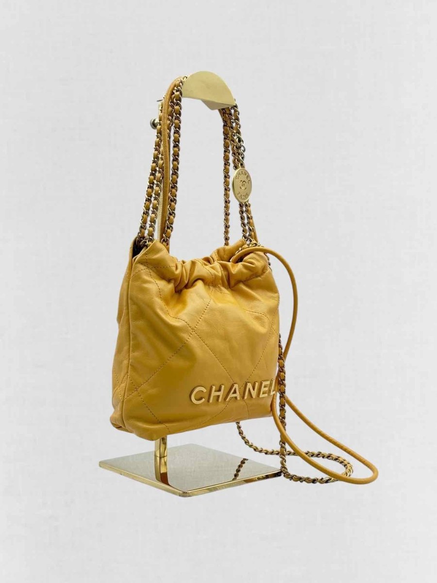 Pre - loved CHANEL 22 Mustard Quilted Crossbody at Reems Closet