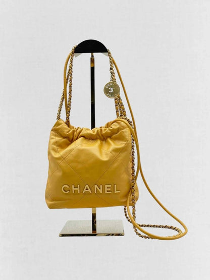 Pre - loved CHANEL 22 Mustard Quilted Crossbody at Reems Closet