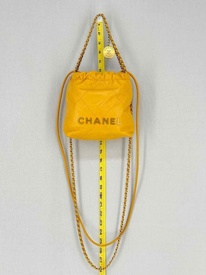 Pre - loved CHANEL 22 Mustard Quilted Crossbody at Reems Closet