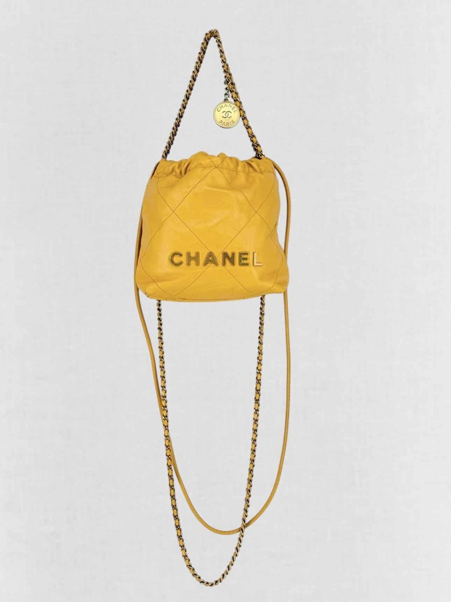 Pre - loved CHANEL 22 Mustard Quilted Crossbody at Reems Closet
