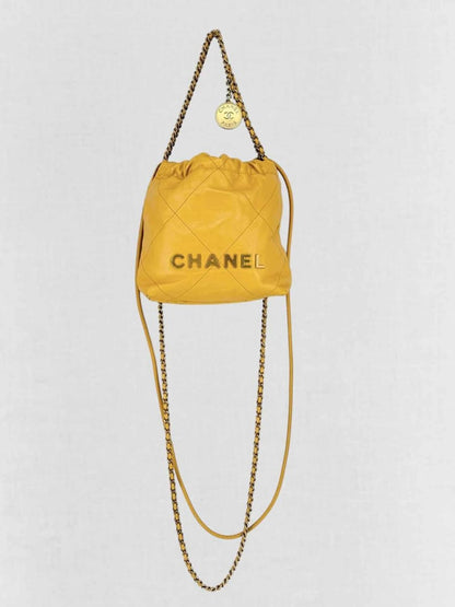 Pre - loved CHANEL 22 Mustard Quilted Crossbody at Reems Closet