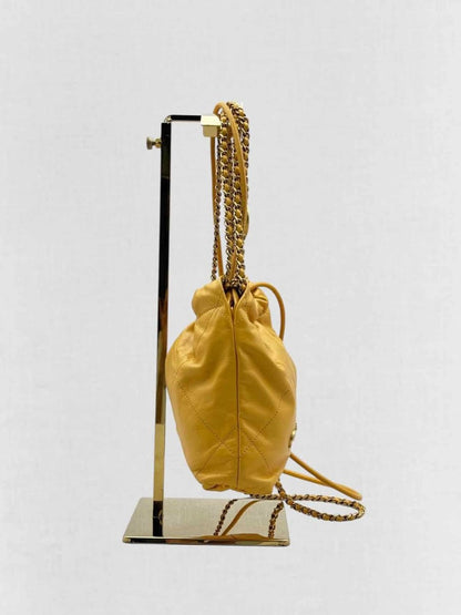 Pre - loved CHANEL 22 Mustard Quilted Crossbody at Reems Closet