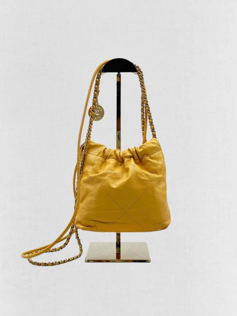 Pre - loved CHANEL 22 Mustard Quilted Crossbody at Reems Closet