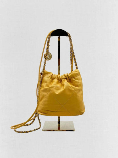 Pre - loved CHANEL 22 Mustard Quilted Crossbody at Reems Closet