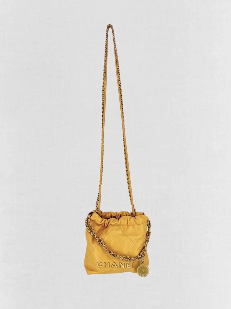 Pre - loved CHANEL 22 Mustard Quilted Crossbody at Reems Closet