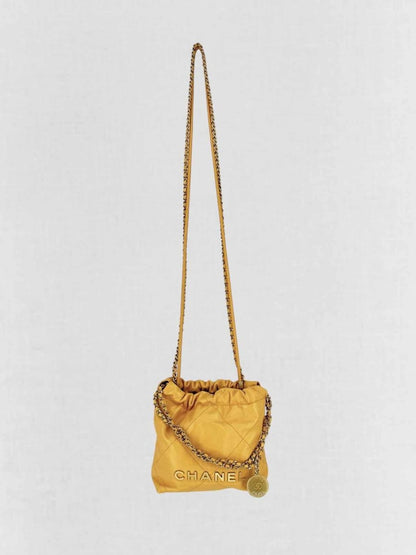 Pre - loved CHANEL 22 Mustard Quilted Crossbody at Reems Closet