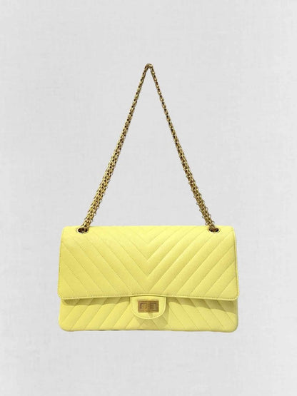 Pre - loved CHANEL 2.55 Reissue Yellow Chevron Shoulder Bag at Reems Closet