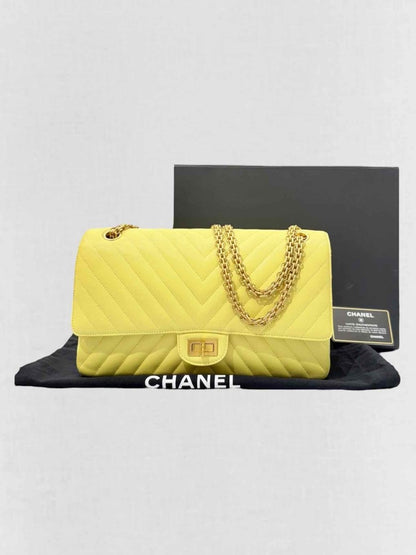 Pre - loved CHANEL 2.55 Reissue Yellow Chevron Shoulder Bag at Reems Closet