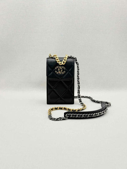 Pre-loved CHANEL Black Quilted Phone case at Reems Closet