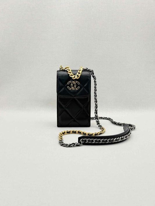 Pre-loved CHANEL Black Quilted Phone case at Reems Closet