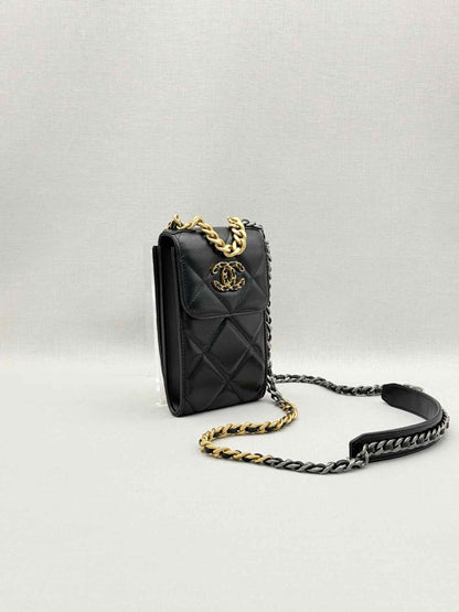 Pre-loved CHANEL Black Quilted Phone case at Reems Closet