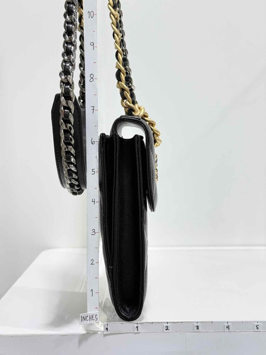 Pre-loved CHANEL Black Quilted Phone case at Reems Closet