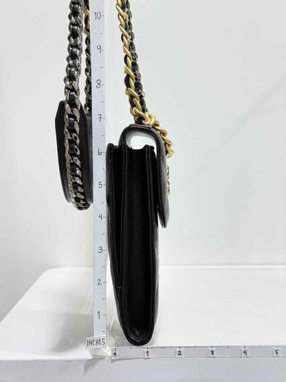 Pre-loved CHANEL Black Quilted Phone case at Reems Closet