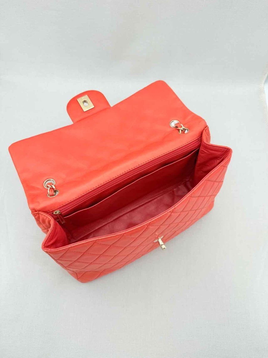 Pre - loved CHANEL Business Orange Quilted Shoulder Bag at Reems Closet