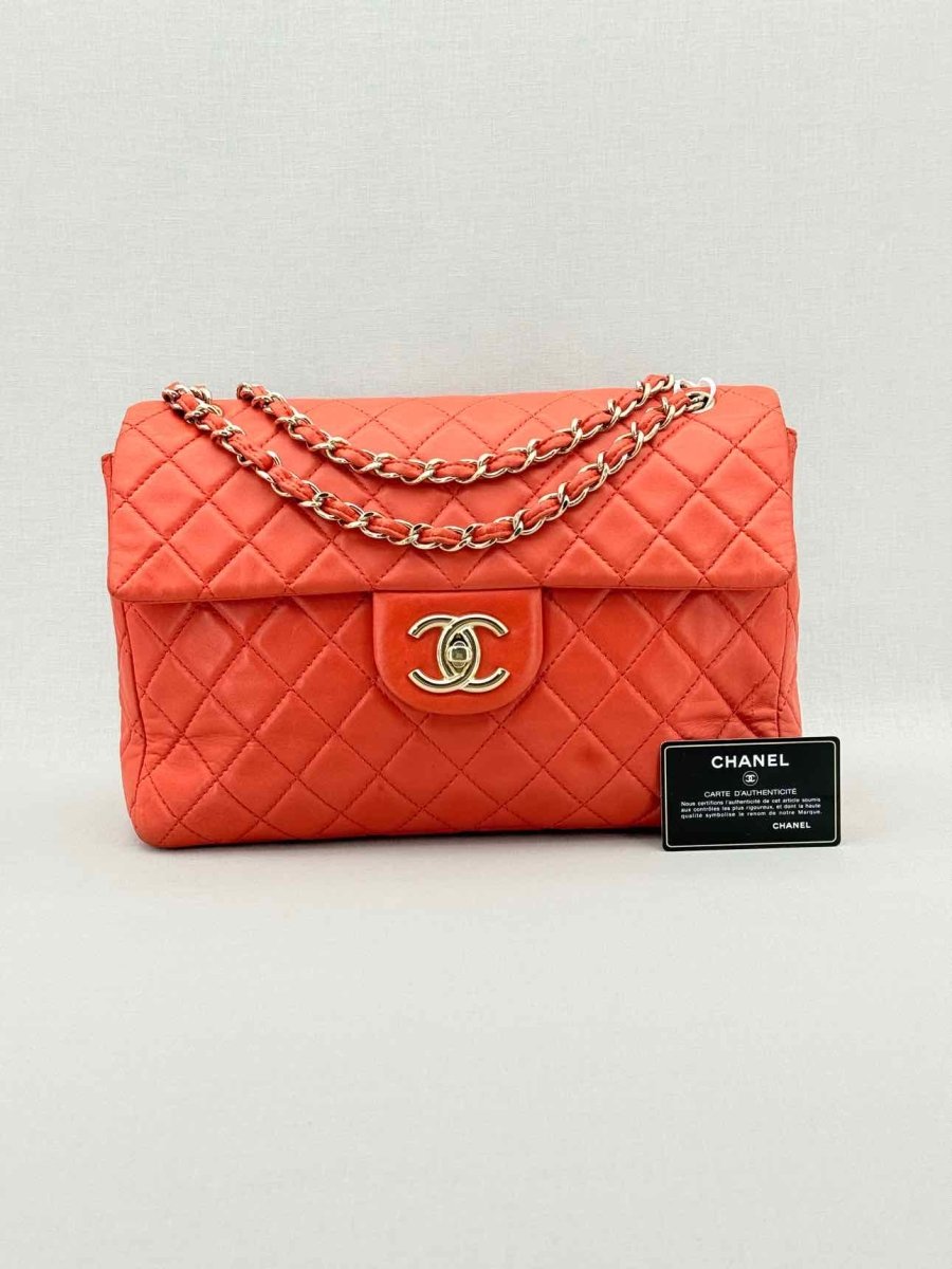 Pre - loved CHANEL Business Orange Quilted Shoulder Bag at Reems Closet