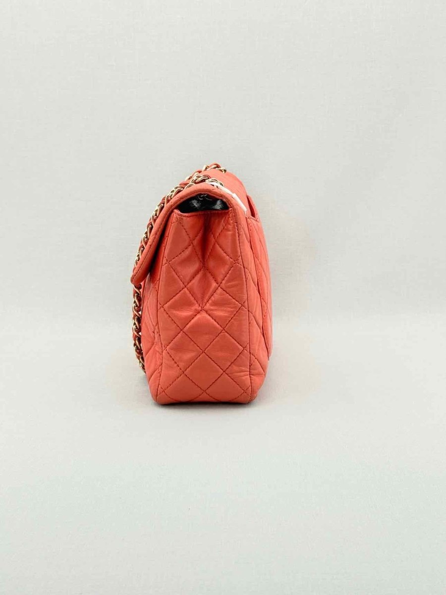 Pre - loved CHANEL Business Orange Quilted Shoulder Bag at Reems Closet