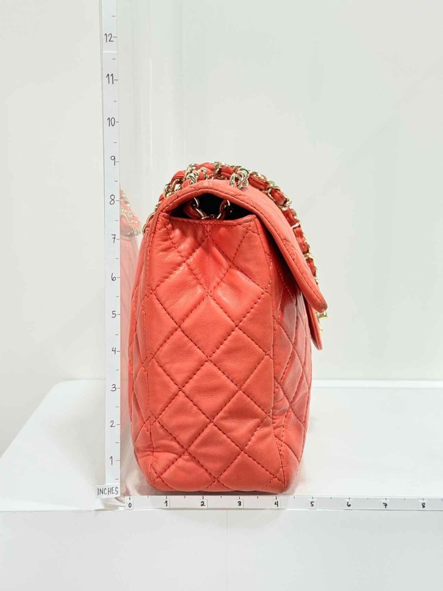 Pre - loved CHANEL Business Orange Quilted Shoulder Bag at Reems Closet