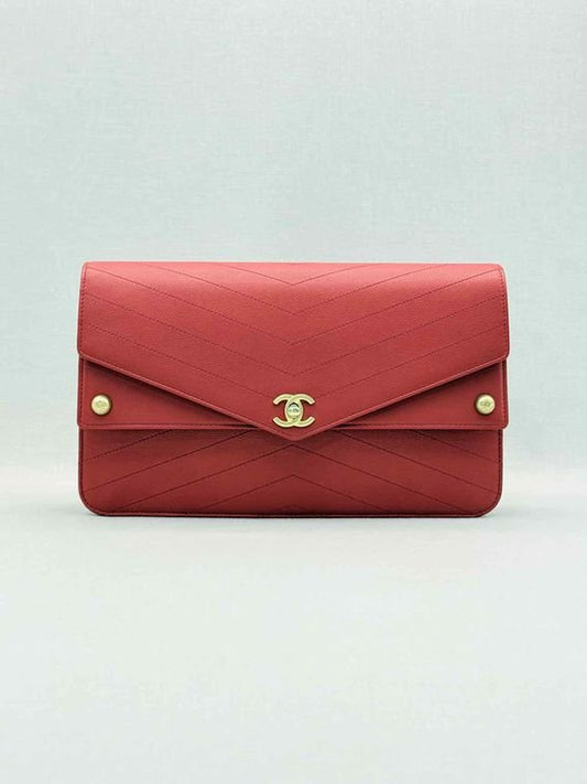 Pre-loved CHANEL Casual Trip Red Chevron Quilted Clutch at Reems Closet