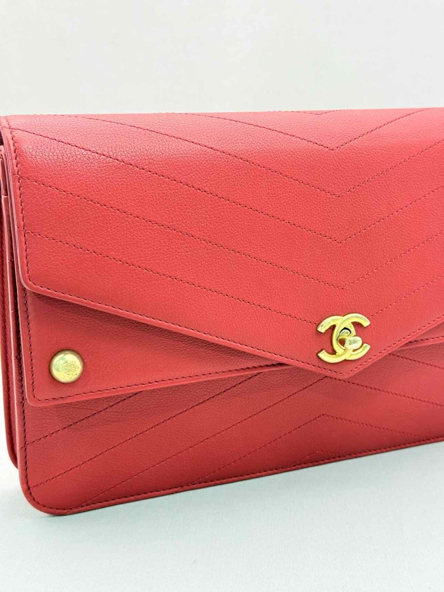 Pre-loved CHANEL Casual Trip Red Chevron Quilted Clutch at Reems Closet