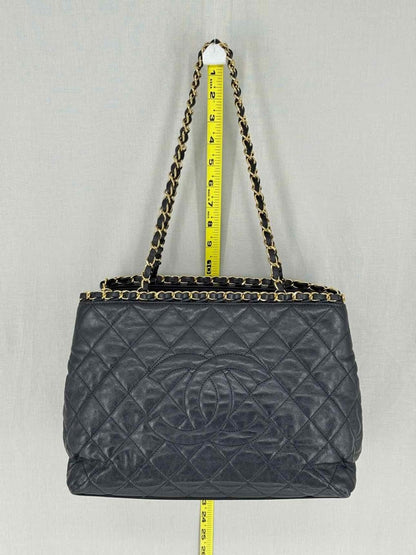 Pre - loved CHANEL Chain Me Black Quilted Tote Bag at Reems Closet