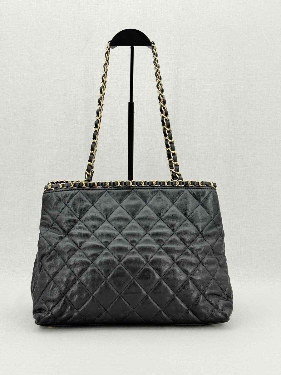 Pre - loved CHANEL Chain Me Black Quilted Tote Bag at Reems Closet