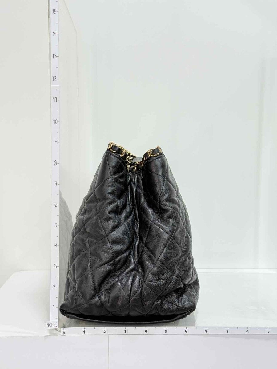 Pre - loved CHANEL Chain Me Black Quilted Tote Bag at Reems Closet