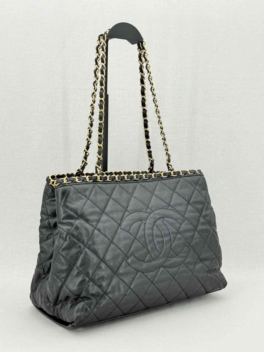 Pre - loved CHANEL Chain Me Black Quilted Tote Bag at Reems Closet