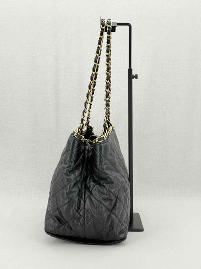 Pre - loved CHANEL Chain Me Black Quilted Tote Bag at Reems Closet