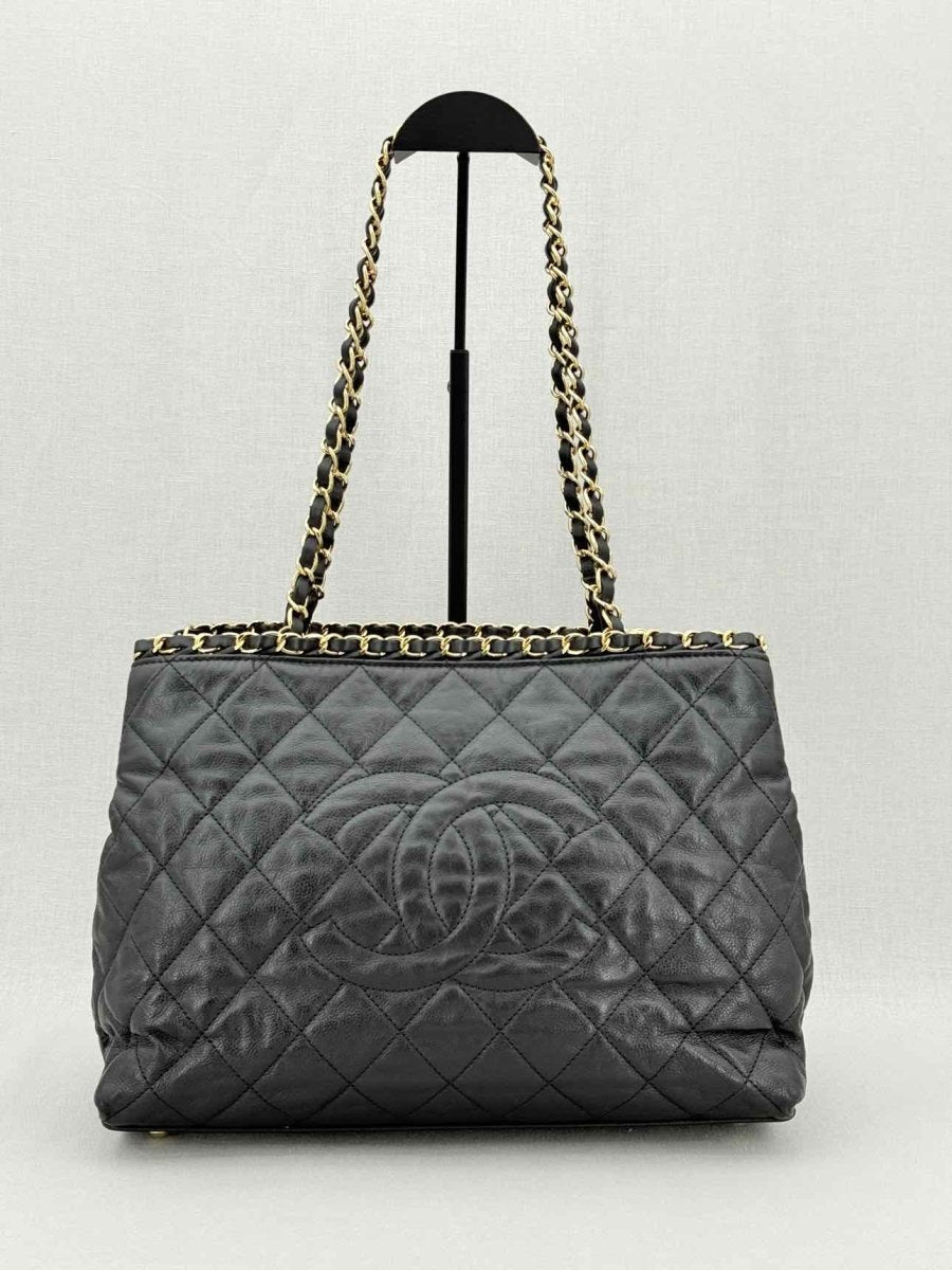 Pre - loved CHANEL Chain Me Black Quilted Tote Bag at Reems Closet