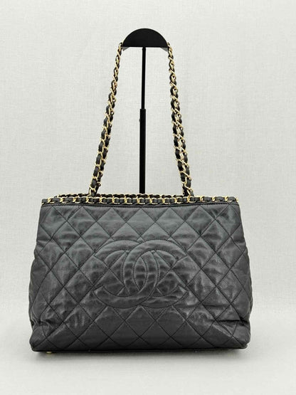 Pre - loved CHANEL Chain Me Black Quilted Tote Bag at Reems Closet